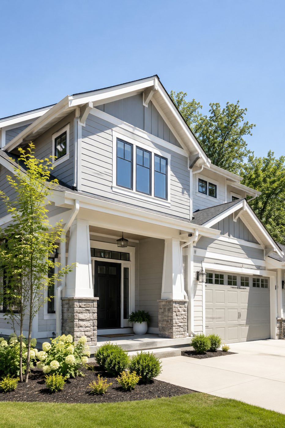 Freshly painted craftsman home exterior with gray siding and white trim in Seattle